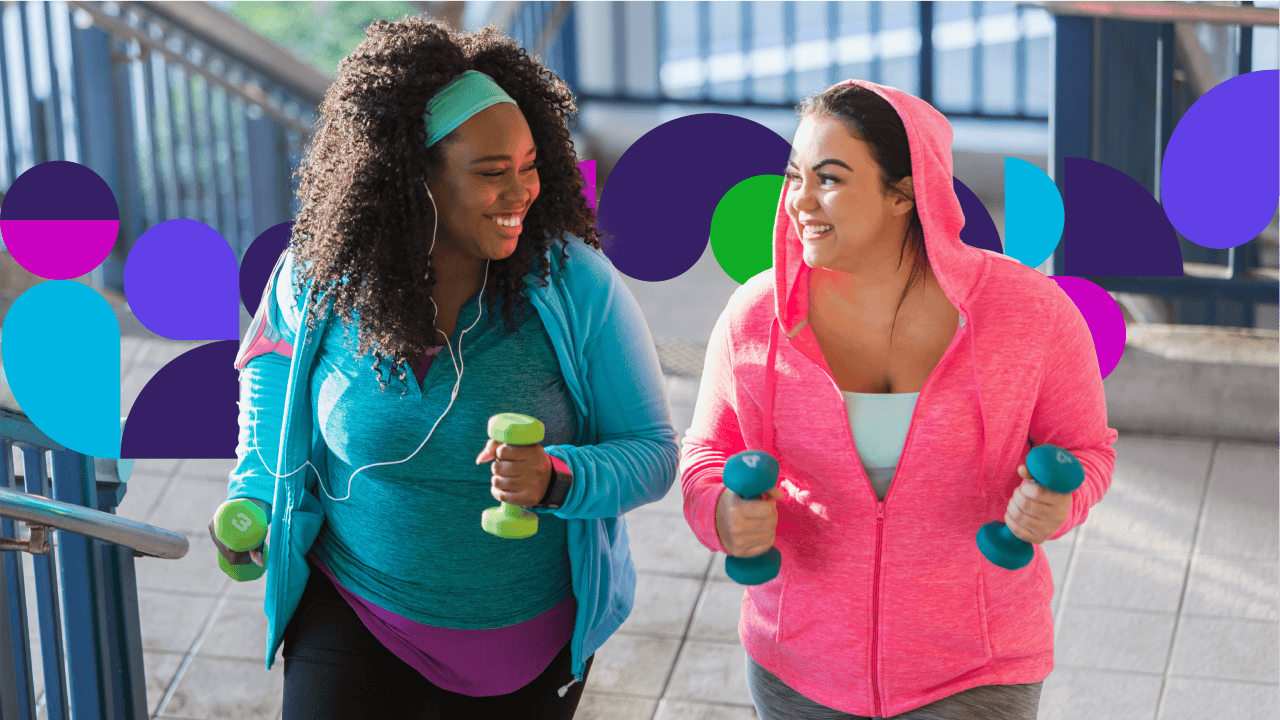 Two women in workout clothes holding weights