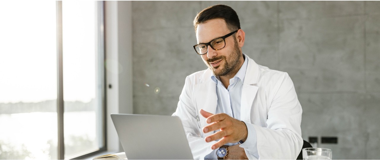 Healthcare leader reviewing a digital strategy dashboard for enterprise virtual care.