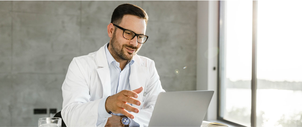 Healthcare leader reviewing a digital strategy dashboard for enterprise virtual care.