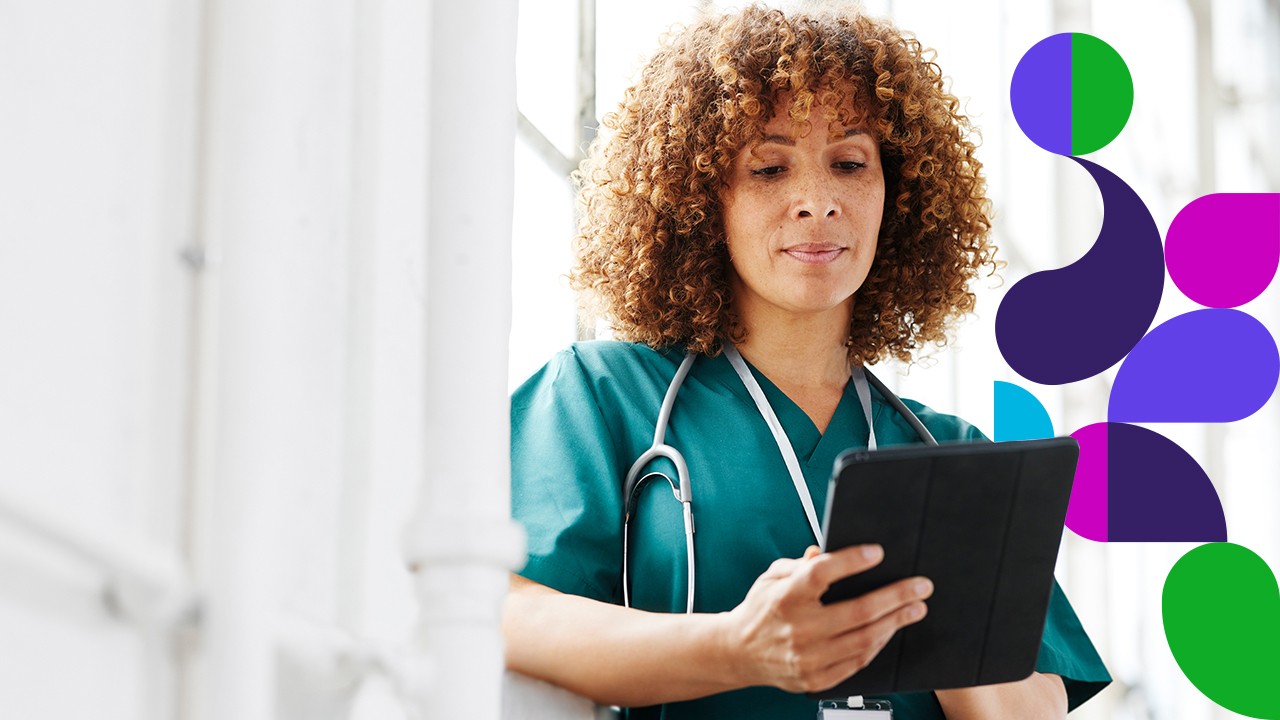 Medical professional looking at tablet