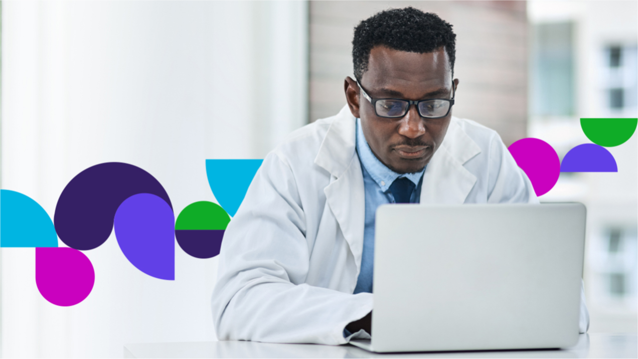  Medical profession looking at a laptop