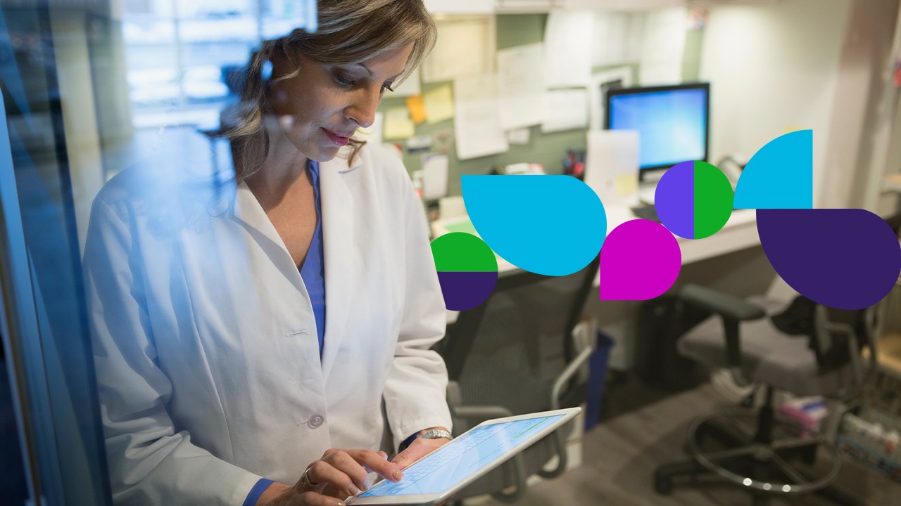 Woman looking at tablet in office