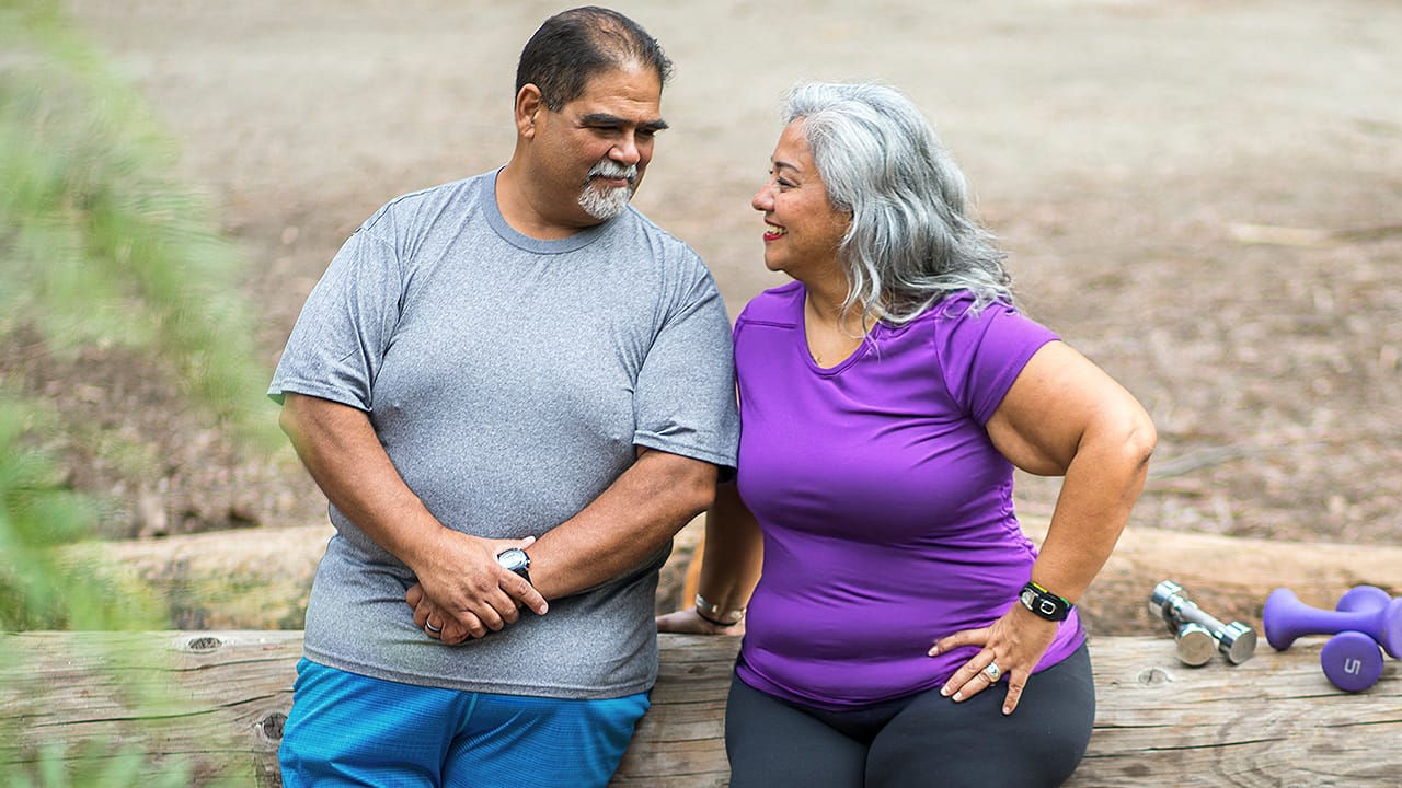 Man and woman standing looking at each other