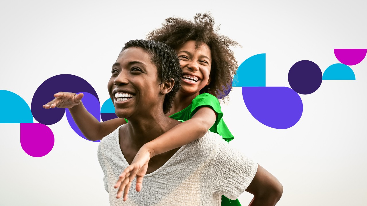 woman holding girl on back