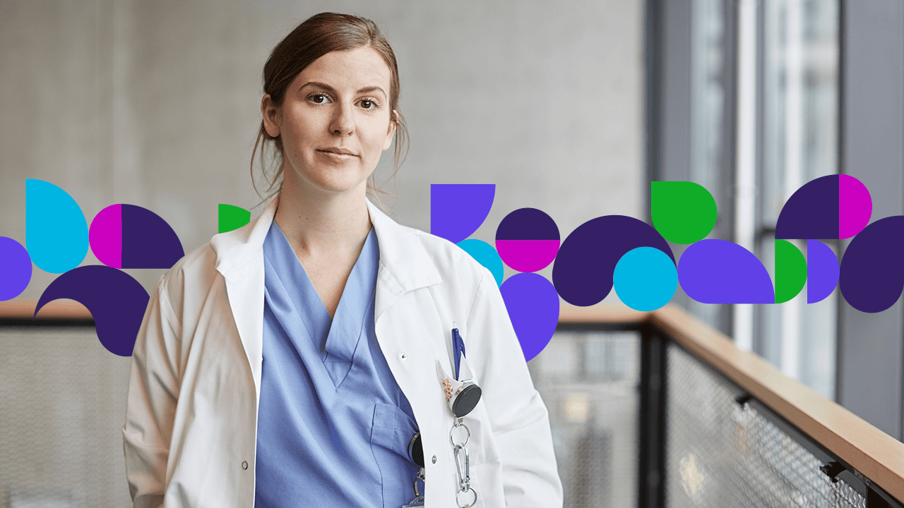 Doctor standing in hallway smiling