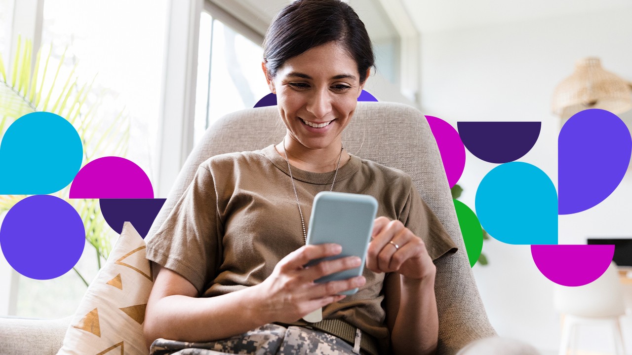 Woman in chair looking at cell phone