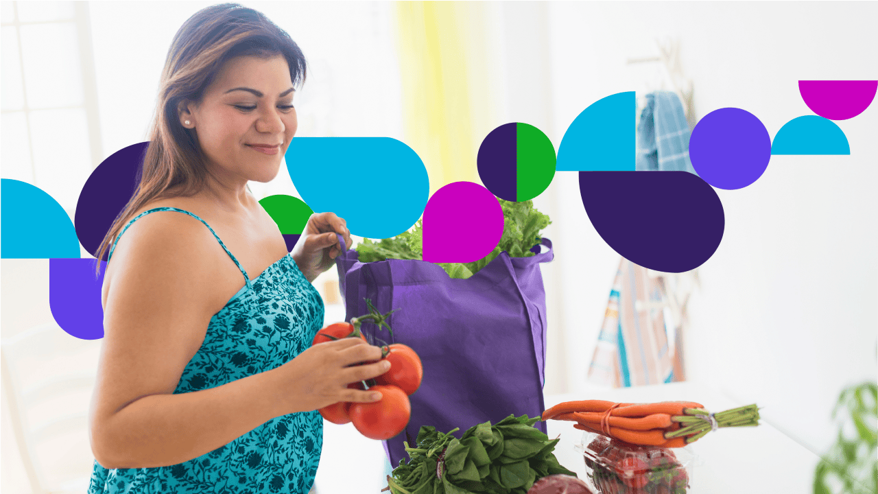 Woman unpacking groceries from bag