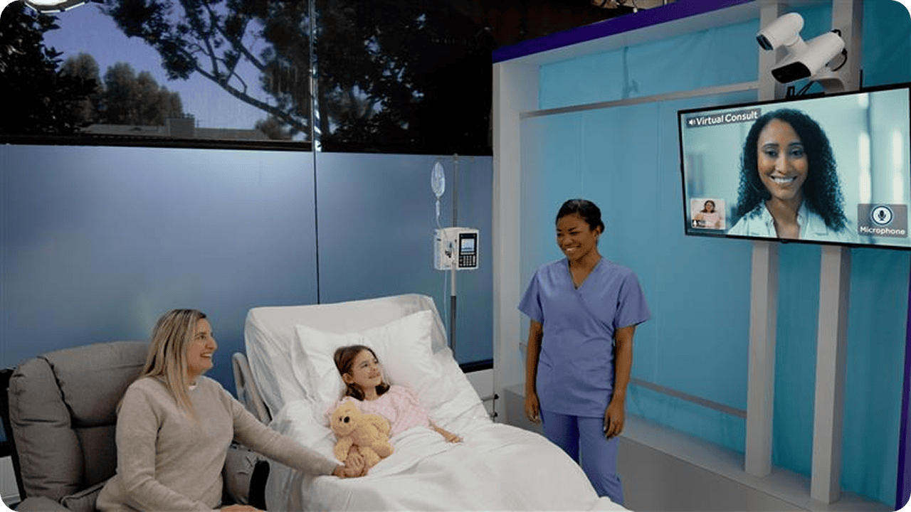 A scene depicting a child in a hospital bed sitting next to a woman and a healthcare professional