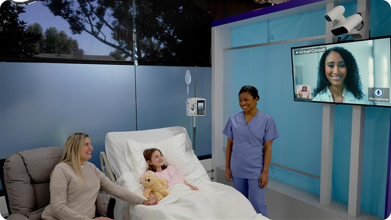 A scene depicting a child in a hospital bed sitting next to a woman and a healthcare professional