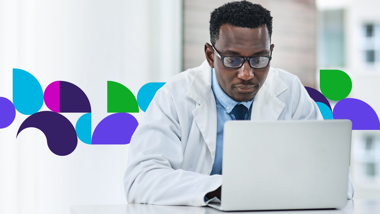 Doctor looking at laptop