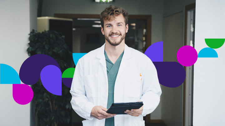 Smiling healthcare professional wearing a white coat and holding a tablet, standing indoors with colorful abstract graphics overlaid in the background.