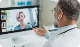 Doctor meeting remotely with his patient