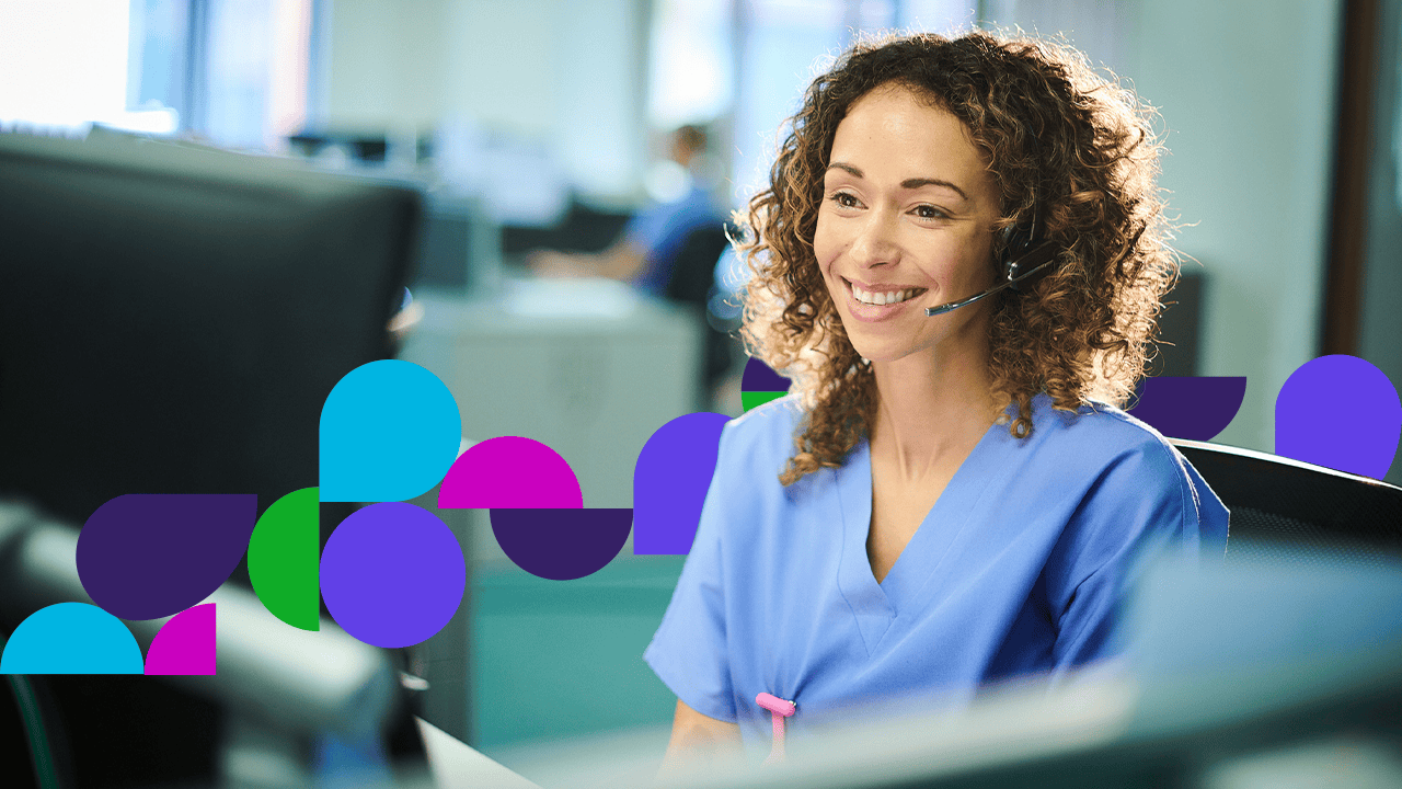 Woman smiling looking at computer screen