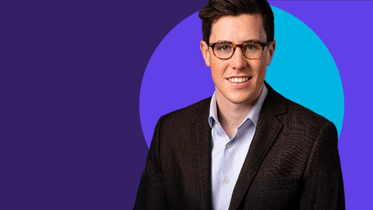 Alex Owens in a dark blazer and light blue shirt against a purple background with the Health Pulse logo.