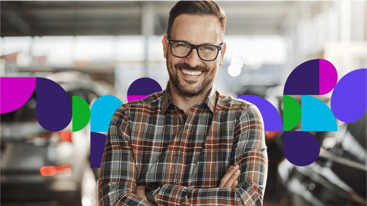 Man in plaid shirt smiling