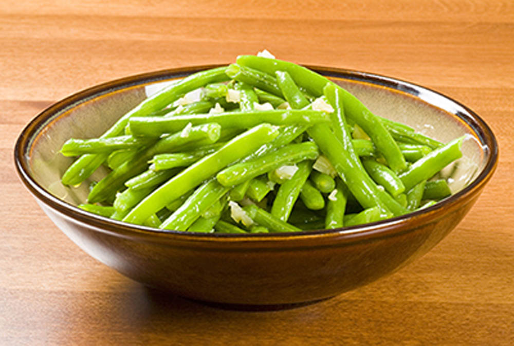 Bowl of Cooked Green Beans and Garlic