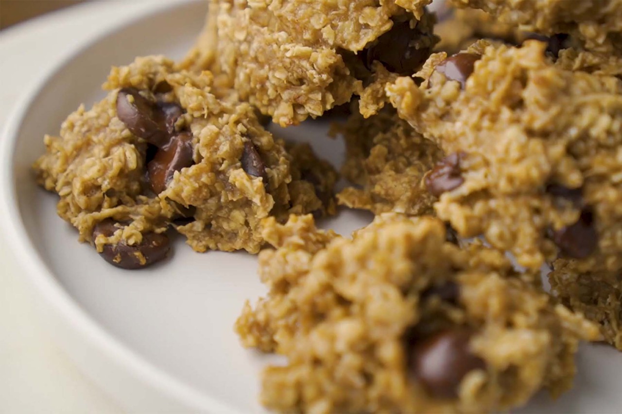 Homemade oatmeal chocolate chip cookies on a white plate.